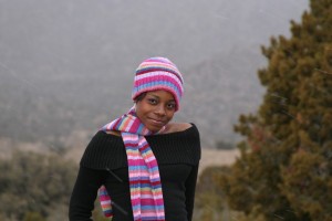girl with pink hat and scarf