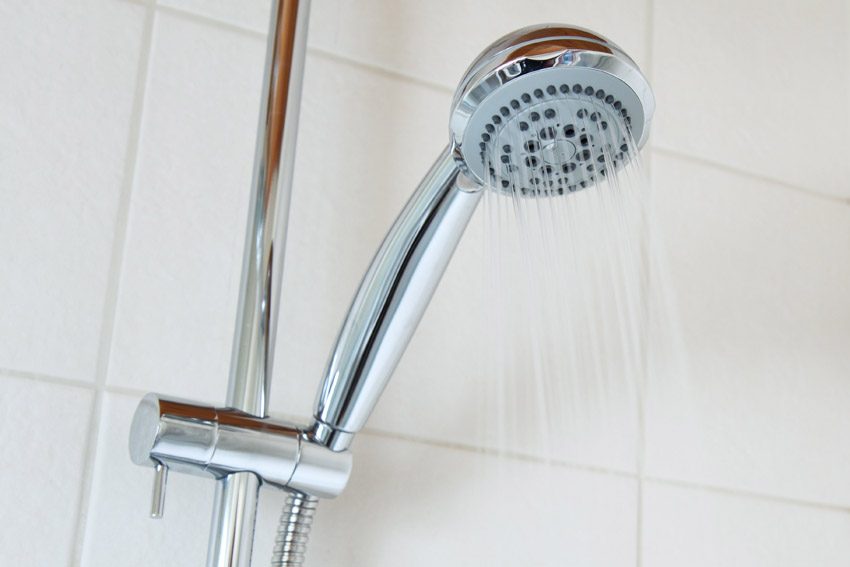 Use vinegar to clean showerheads and faucets
