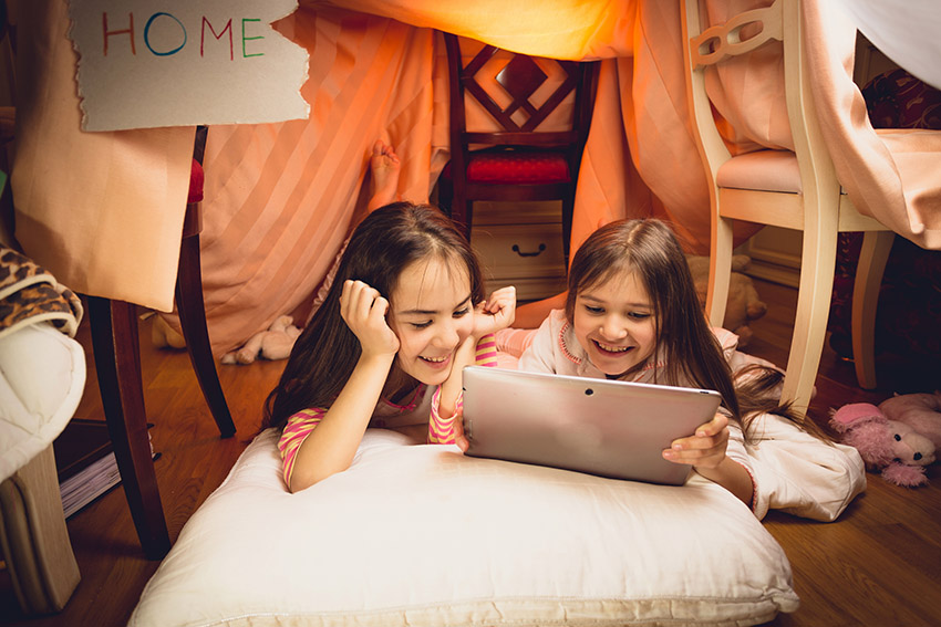 playing in a blanket fort