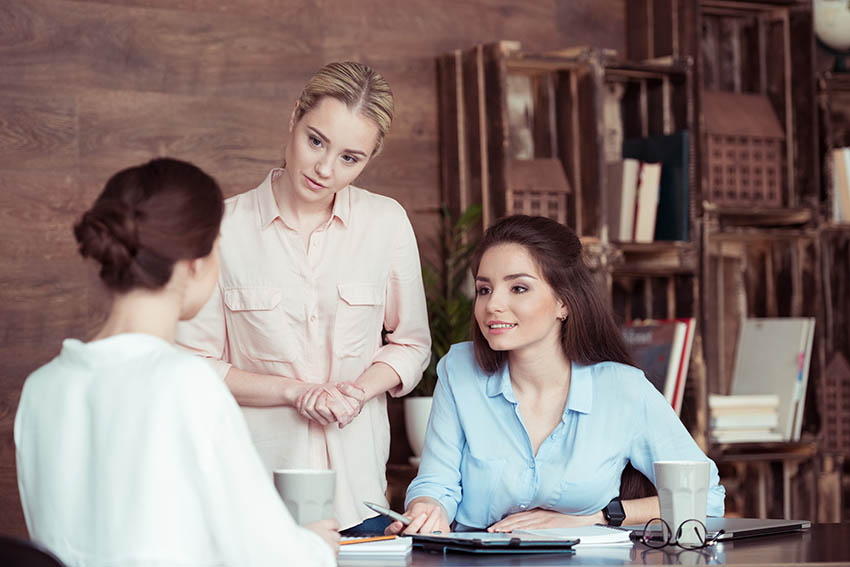 women listening attentively to customer