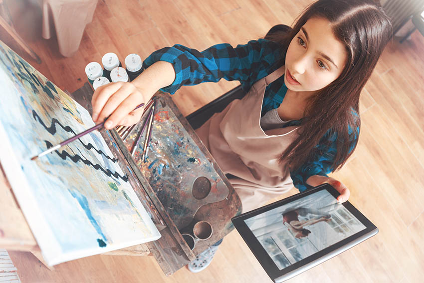 woman learning to paint to recharge her creativity