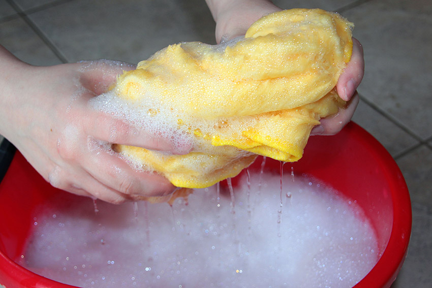 cleaning bucket with soap and cloth