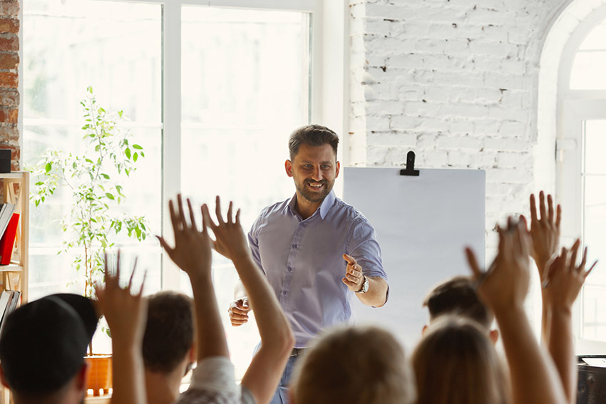 Speaker encouraging questions from his audience to ensure you are understood